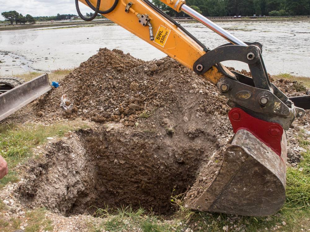 Adding a little material for tamping and creating a flat base