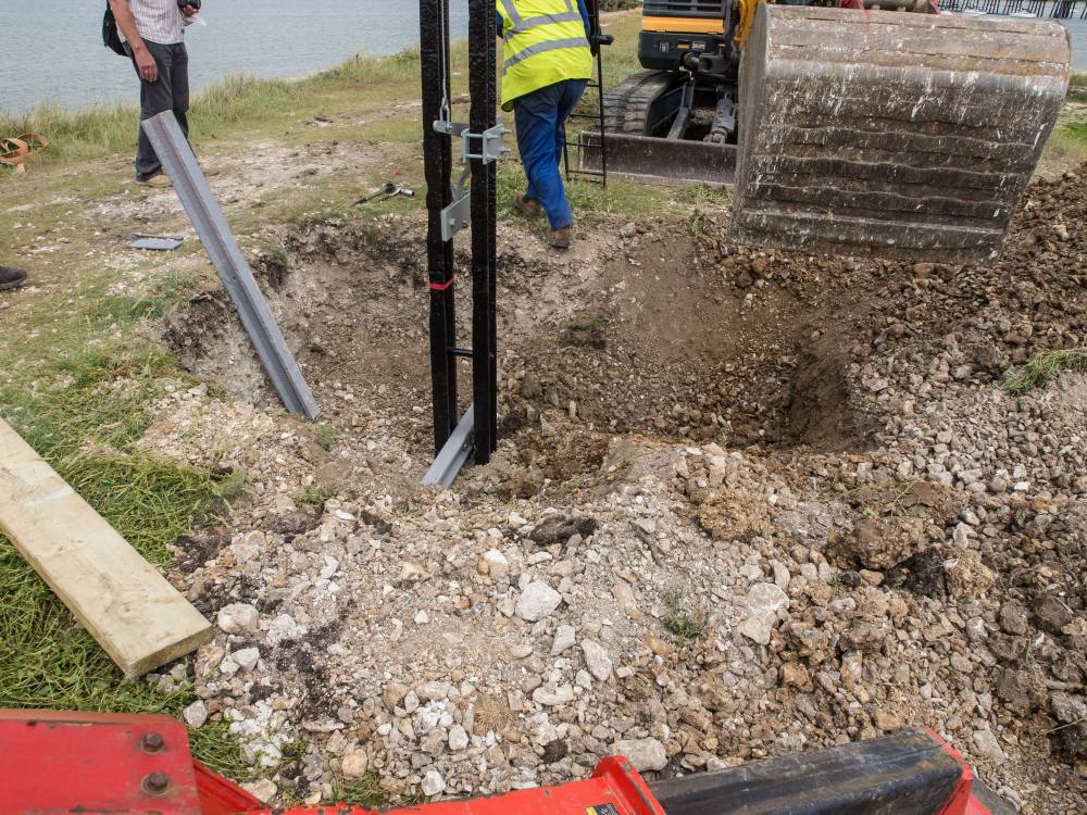The first layer of infill has been dropped into the excavation up to the bull head rail secured to the signal post.
