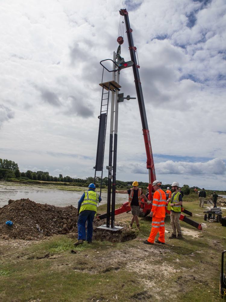 The signal is lowered into the excavation